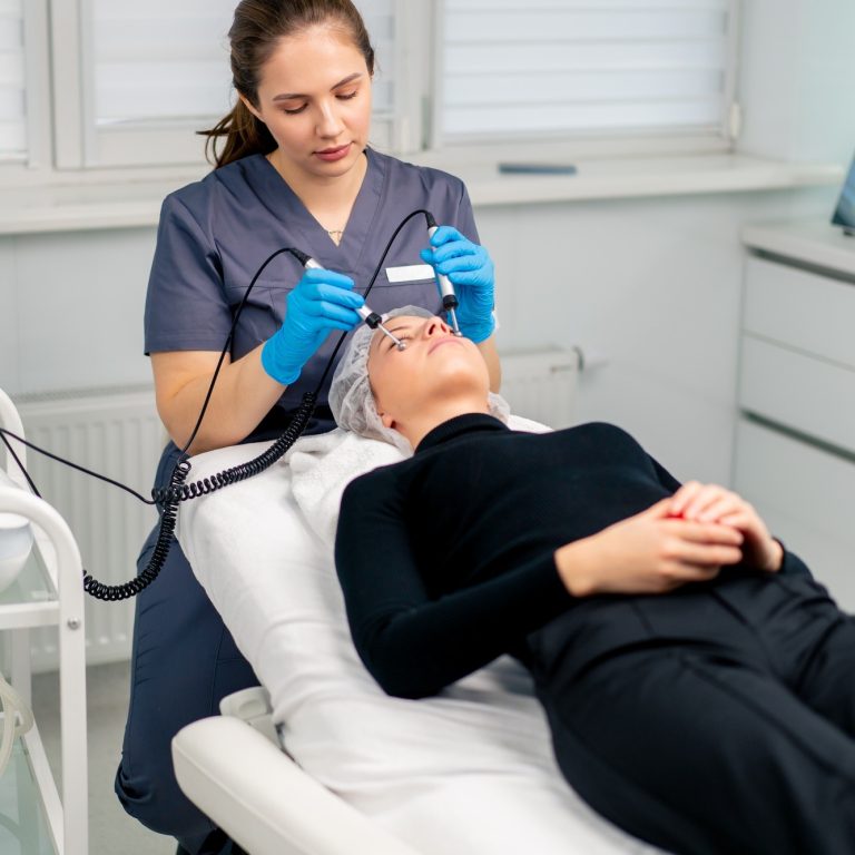 beautician-doctor-massaging-the-skin-of-a-client-s-face-during-beauty-and-health-cosmetic-procedure.jpg